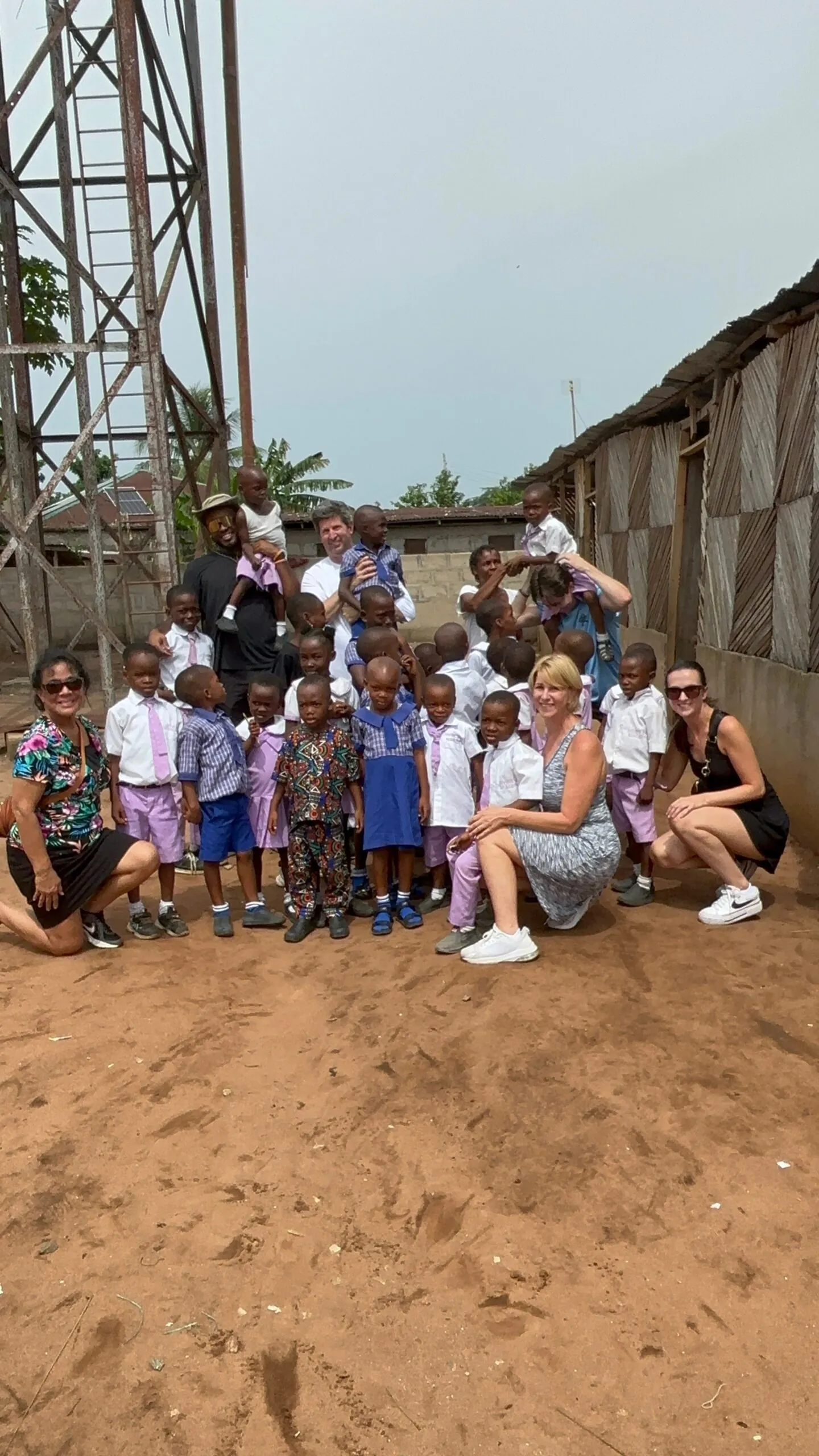 Schoolchildren in uniform outside their classroom