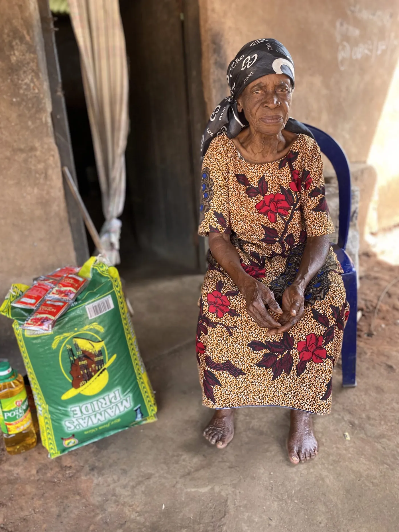 A woman receiving supplies at her home